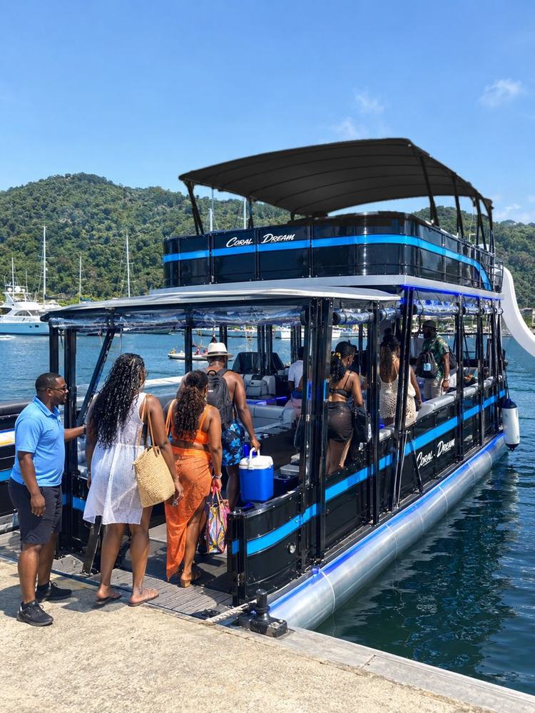 Guests boarding Coral Dream at the marina