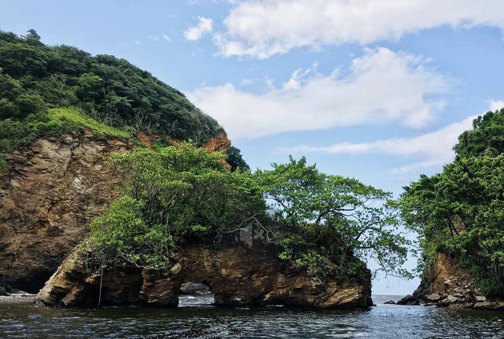 A natural rock arch on Huevos island